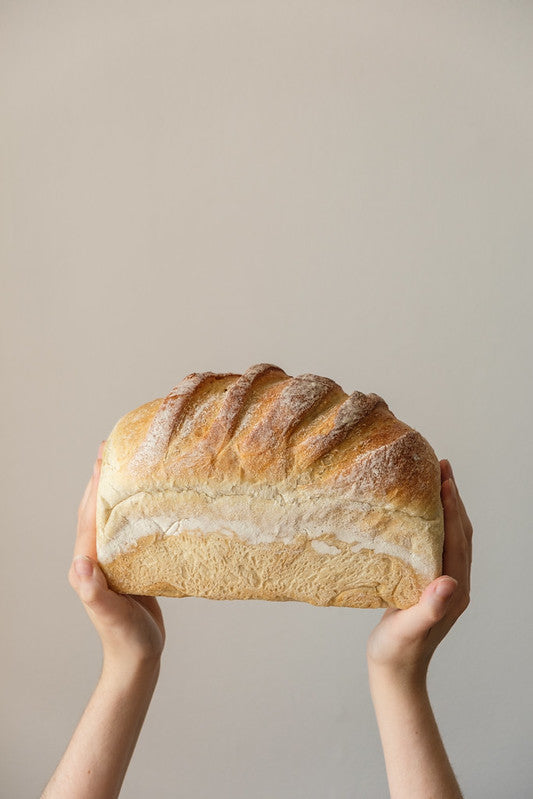 Hands holding Sherston loaf